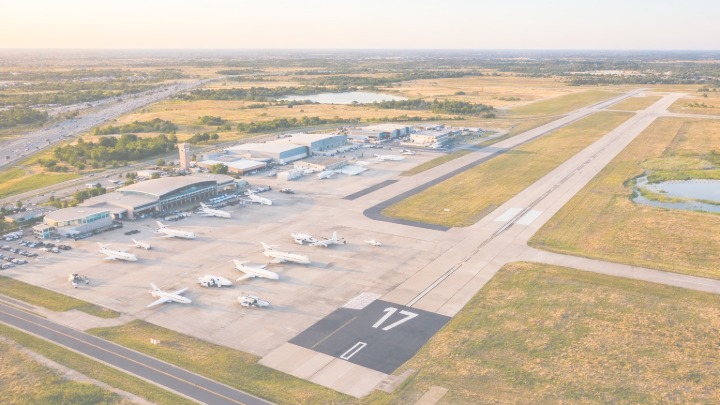 Stylized airport map of Fort Worth Spinks Airport (FWS) showing runway 17/35, executive FBO area, and private aviation layout