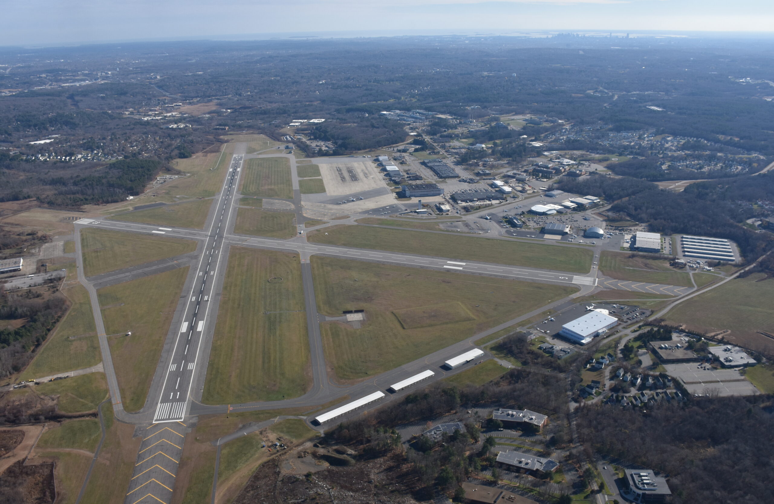 Aerial view of Hanscom Field runway and facilities in Bedford, Massachusetts