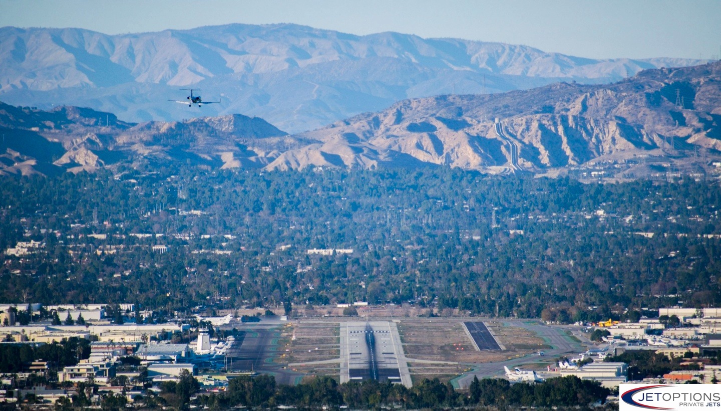 Private jet in the air over Van Nuys Airport, private jet airports Los Angeles